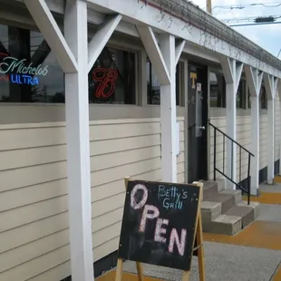 a sign in front of a restaurant