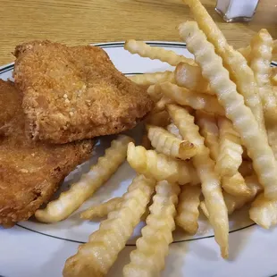 a plate of fried chicken and french fries