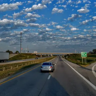 no time to stop today but Betty's truck stop off to left.  the old original Texaco now cenex Sweet springs Missouri.. awesome clouds