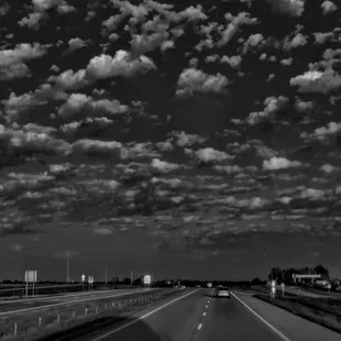 taking advantage of the cool clouds into a high-def black and white edit by me Betty's truck stop in  left abandoned truck stop on right
