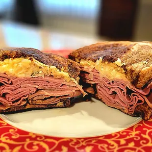 Reuben sandwich with pastrami and corned beef on marble rye.