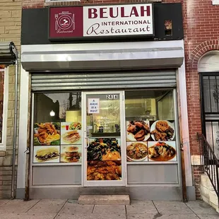 a woman standing in front of a restaurant