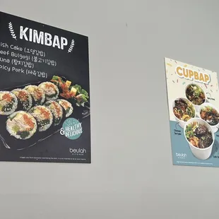 a menu and a poster on a wall