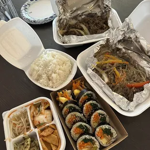 Beef bulgogi with rice, chapchae, fish cake kimbap, and banchan
