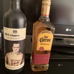 two bottles of liquor on a table
