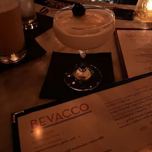 a cocktail in a martini glass on a table