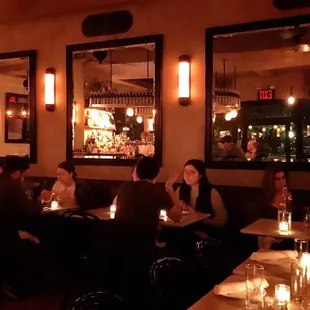 a group of people sitting at a restaurant