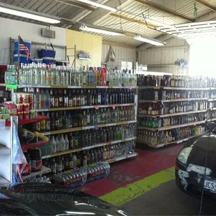 a car parked in front of the shelves