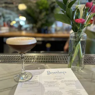 a menu and a drink
