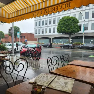 Sitting inside with a view of a not so busy street and rainy skies.