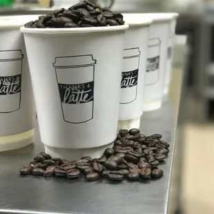 coffee cups and coffee beans