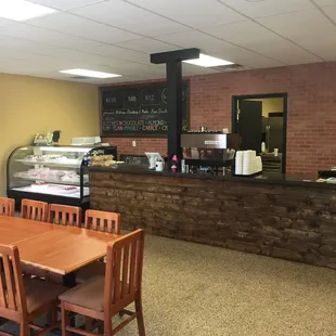 a dining area with tables and chairs