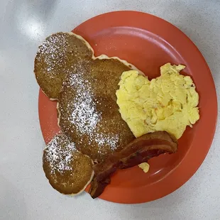 a plate of pancakes and bacon