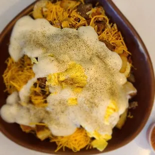 Skillet:eggs, sausage, bacon, potatoes, mushrooms, green peppers, cheese, biscuits on bottom, smothered in gravy.