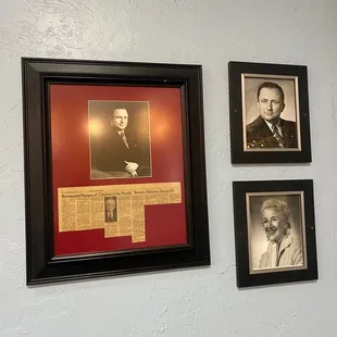a wall of framed photos