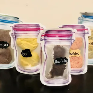 a variety of bevibles in a jar