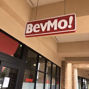 a bevmo sign hanging from the ceiling