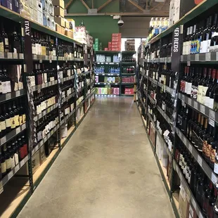 the aisle of a wine store