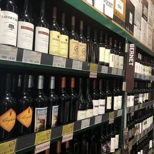 rows of wine bottles in a store