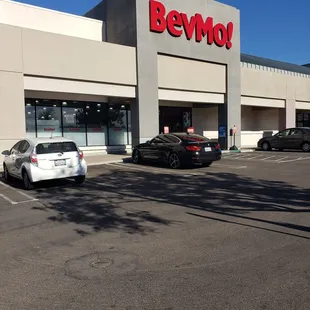 a car parked in front of a bevmo store