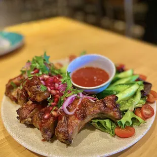 $43 Chalaghaji | Marinated in Adjika sauce, slow-cooked baby pork ribs w/ fresh vegetables.