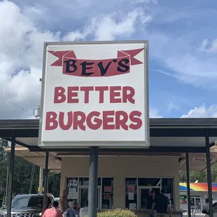 a sign in front of a restaurant