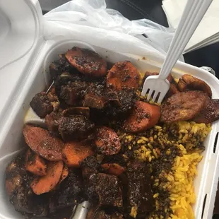 a tray of meat and rice