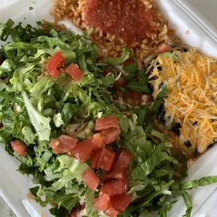 Wet burrito with brisket comes with brown rice and beans