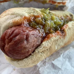 a hot dog with relish and mustard
