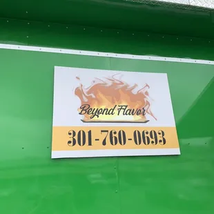 a sign on the side of a food truck