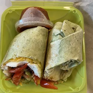Egg, cheese, and avocado on a spinach wrap