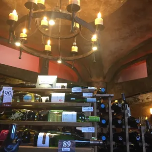 a chandelier of wine bottles