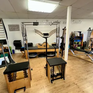 Pilates stability chairs and cadillac with barrel and props