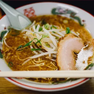 a bowl of ramen and chopsticks