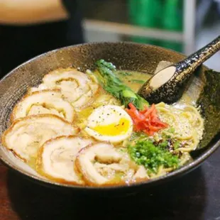 a bowl of ramen and vegetables