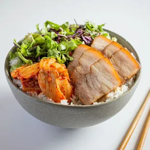 SAM-GYUP BOWL (Marinated Pork Belly) Slow-braised pork belly in soy sauce with Korean soybean paste.