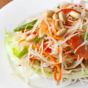 a white plate with a salad on it