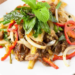 a plate of food with meat and vegetables