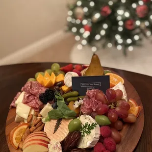 a platter of fruit and cheese