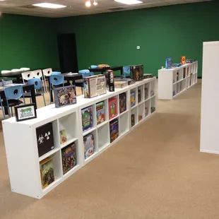 Demo board game shelves, and game play area.