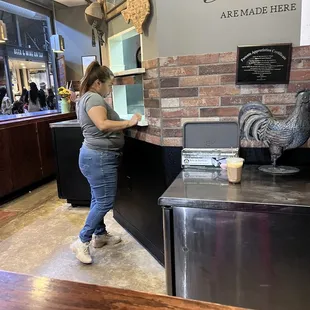 a woman standing at a counter