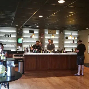 people standing at a bar