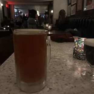 a glass of beer on a table