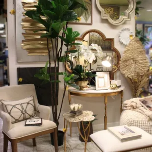 Home décor, accent furniture, silk trees and plants in white and neutrals.