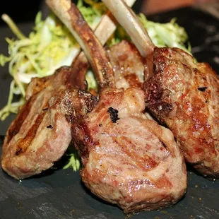 The Colorado Lamb Lolli Pops were served with Romesco &amp; Frisee Salad.