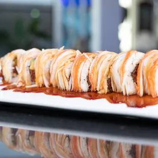 a plate of sushi rolls