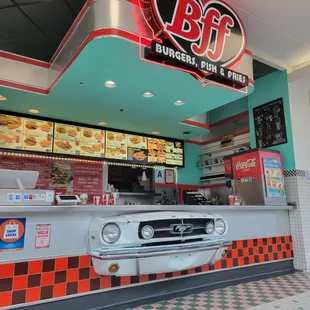 a car parked in front of a diner