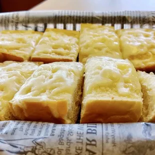 four slices of cheese bread in a basket