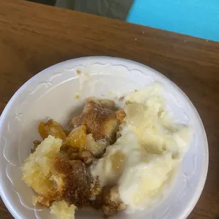 Peach cobbler with homemade vanilla ice cream
