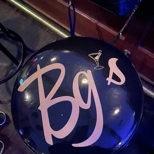 a blue sign with the word bg's on it